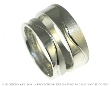 Contrasting wave wedding rings with engraved line