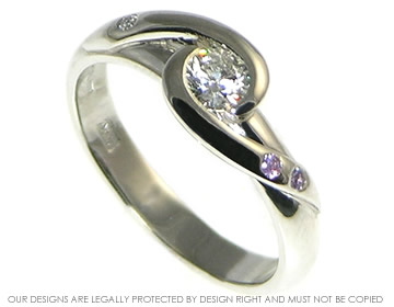 Bespoke platinum engagement ring incoporating customers own F VS2 brilliant cut 0.30ct diamond, with a new brilliant cut 1.5mm H SI diamond and two purple sapphires