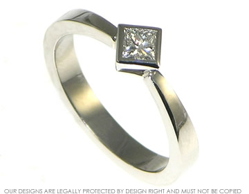 Contemporary palladium and all around set princess cut diamond engagement ring. 