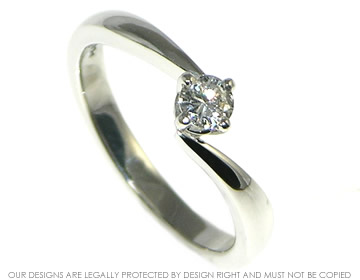 Bespoke platinum twist style engagement ring with a recycled diamond.