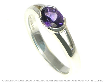 Sterling silver engagement ring with a 0.74ct oval facetted amethyst in an end only setting