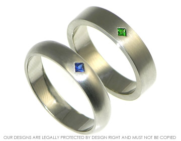 Palladium commitment rings with blue and green sapphires