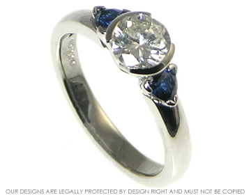 Bespoke palladium art deco inspired engagment ring using customers own diamond.