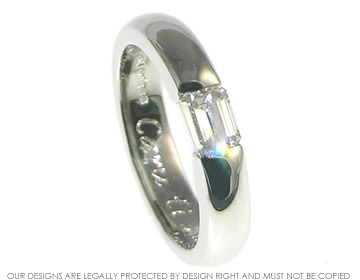 Bespoke platinum tension style engagement ring incorporating customer's own emerald cut ~4.4x3.9mm 0.51ct diamond.