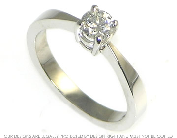 Bespoke platinum engagement ring with a four claw set diamond