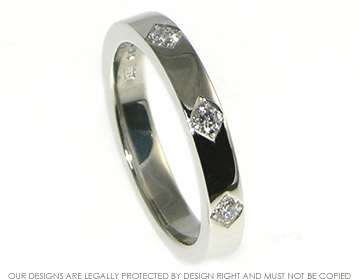 Bespoke platinum eternity ring with three diamonds