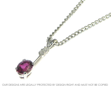 9ct white gold oval cut 1.27cts ruby pendant with a 2mm and a 2.5mm H SI diamond.