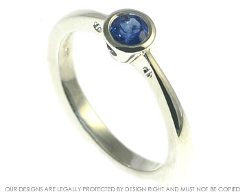 Sterling silver engagement ring with a brilliant cut sapphire