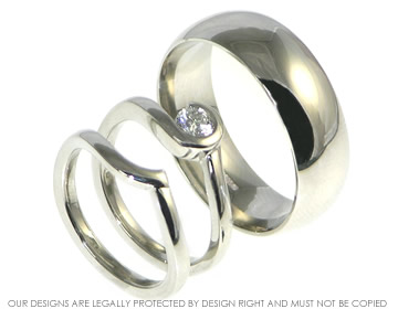 Heather's wedding ring is designed to fit around her engagement ring.