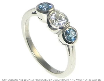 Palladium and recycled diamond and aquamarine three stone ring.