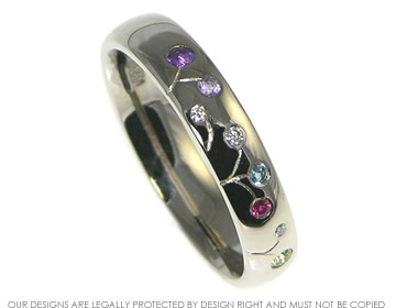 Jeanette wanted a meadow inspired eternity ring with their birthstones