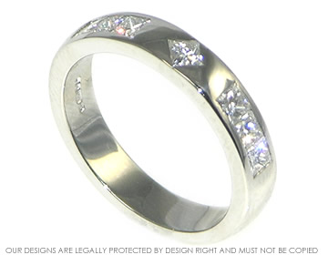 Abbie's platinum Engagement ring with seven own diamonds