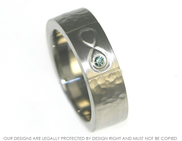 Colin's palladium wedding ring with engraved detail and a diamond