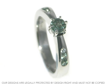 Josh designed this green sapphire engagement ring for Charlotte