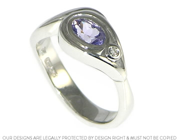 18ct white gold flower inspired diamond and lilac sapphire ring