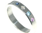 silver eternity ring with topaz, sapphire and diamond