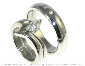 Russel's platinum wedding ring with hole detailing