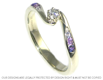 A striking combination of white diamond and purple sapphires.