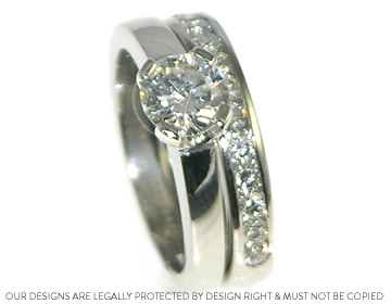 A classic and timeless platinum engagement and wedding ring set.