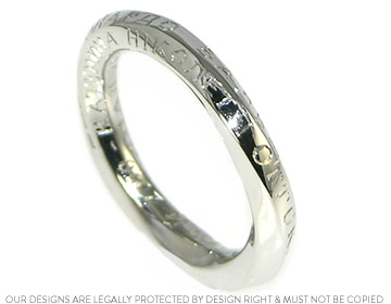 Alexandra and Diramid's platinum Eternity ring with Ukranian lettering