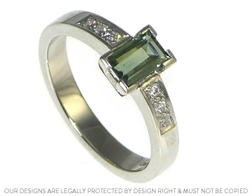 Art deco inspired ring with a stunning green sapphire. 