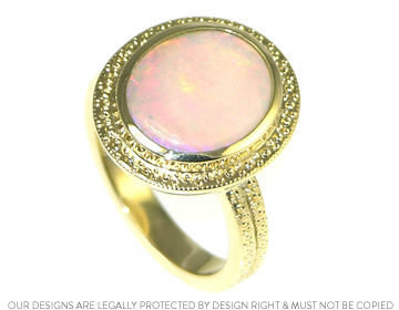 This beautiful Opal dress ring has beading around the stone