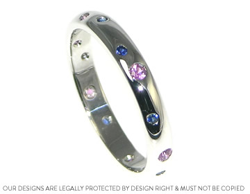 scatter set eternity ring with pink and blue (girl and boy) sapphires