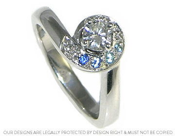 A stunning 9ct white gold ocean wave inspired twist diamond engagement ring