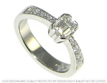 Janine's platinum and emerald cut diamond engagement ring