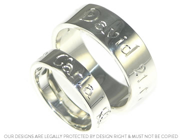 David and Carla's matching silver wedding rings with delicate engraving