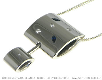 Lyn's palladium, diamond and blue sapphire rotational pendant