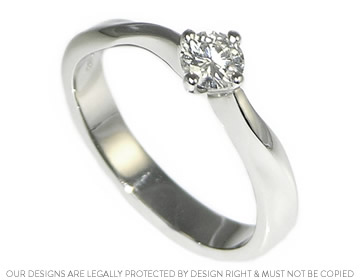 Platinum 'Mobius twist' inspired  engagement ring with a claw set recycled diamond 