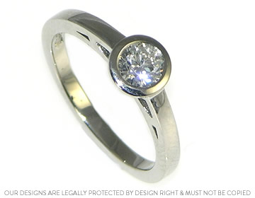 palladium and 0.44ct diamond solitaire with cutwork side detailing