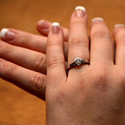 palladium and 0.44ct diamond solitaire with cutwork side detailing