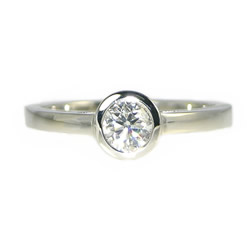 palladium and 0.44ct diamond solitaire with cutwork side detailing