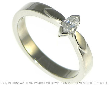 Palladium engagement ring with a marquise diamond and marquise shapes