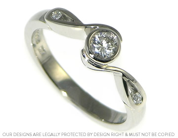 Palladium and diamond engagement ring inspired by a droplet shape