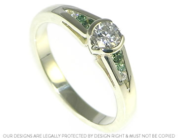 Natalie's engagement ring, with graduating stones on either side of the central diamond.