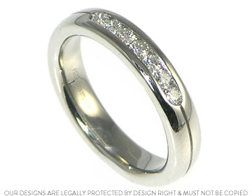 We added diamonds to Cheryls platinum eternity ring