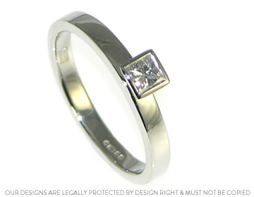 Platinum engagement ring with a princess cut diamond 