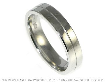 Handcrafted platinum man's wedding ring, with engraved line