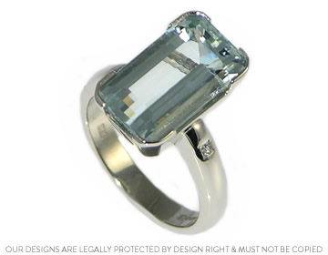 A dramatic Art deco inspired aquamarine and diamond dress ring