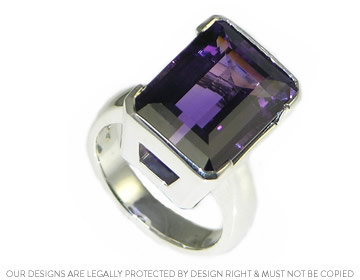 A striking Amethyst and silver dress ring