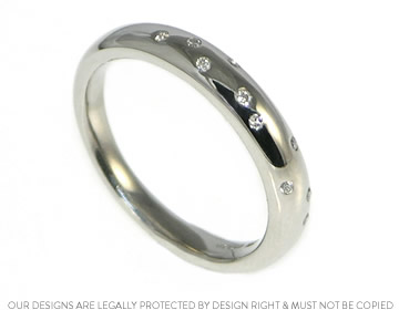 Palladium eternity ring with ten scatter set sparkly diamonds