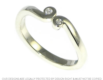 9ct white gold and diamond engagement ring with an organic swirl design.