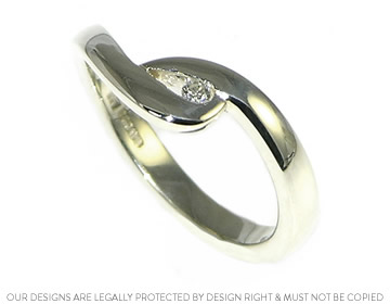 Delicate 9ct white gold and diamond twist engagement ring.