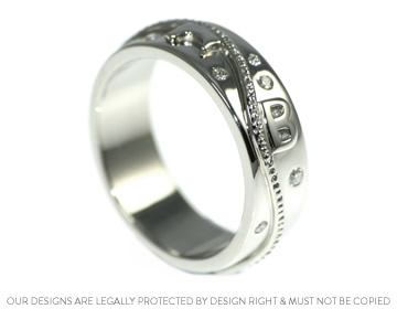 Luke's palladium wedding ring with scatter set diamonds