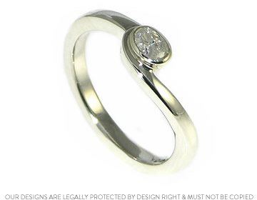 Helen's 9ct white gold engagement ring with an oval cut sparkly diamond