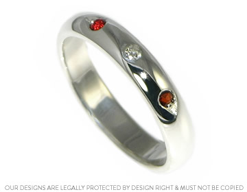 Hayley's personally designed diamond and garnet wedding ring