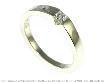 Lucy's 9ct white gold tension style engagement ring with a sparkly diamond 